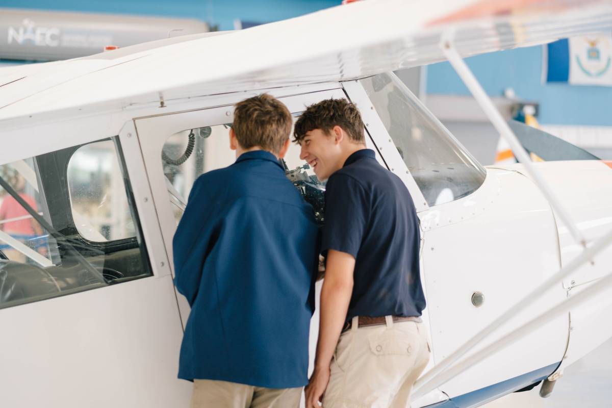 RAHS students at an airplane