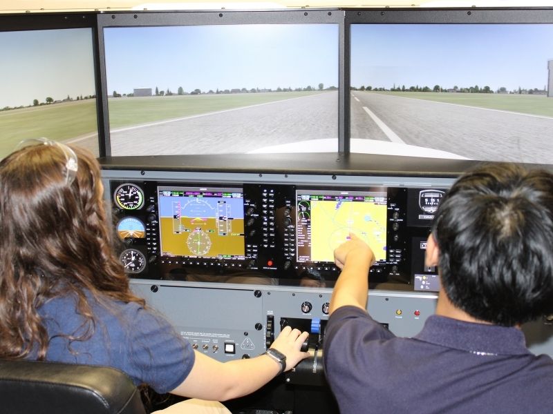 Rising Aviation students in the simulator lab